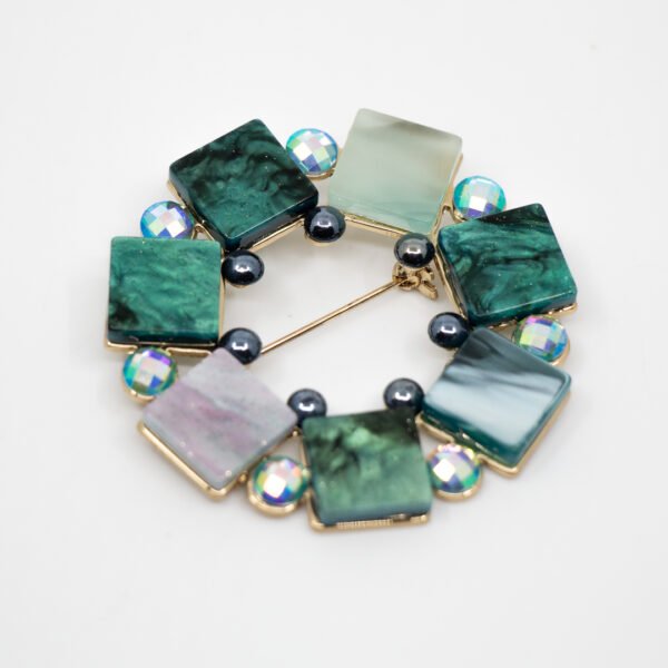 Broche circular de resina verde